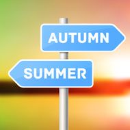 Blue sign post with directional arrows summer arrow and autumn