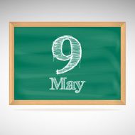 May 9 inscription in chalk on a blackboard
