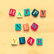 Words happy new year with colorful blocks