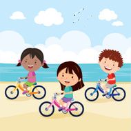 Kids cycling on the beach