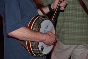 man playing banjo