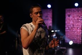 Topi Latukka singing at concert