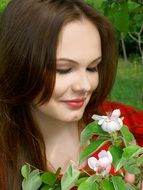 Portrait of a girl near white flowers