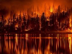 wildfire reflected in the water