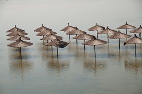 flooded beach umbrellas