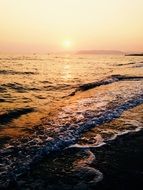 ocean beach at orange twilight