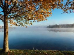 A calm lake in the haze