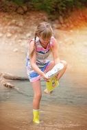 picture of the girl is on a lake