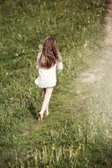 Girls walking green grass