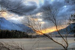 snow covered lake in british columbia at sunset