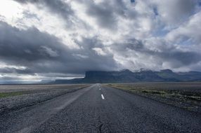 Asphalt straight road in fields