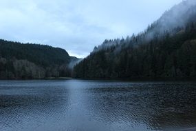 picturesque lake along the misty mountains