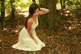 girl with long hair on the forest background