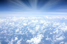 sunlight over white clouds in the sky