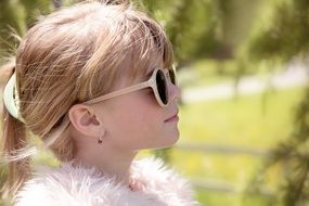 profile portrait of Blonde girls in sunglasses