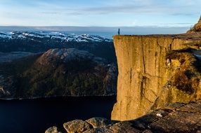 Man on top mountain sunset norway scandinavia