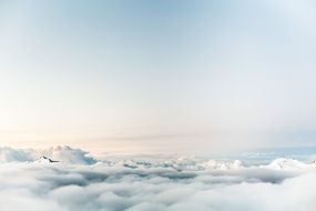 mountain peaks above the clouds