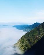 amazingly beautiful foggy mountain peak
