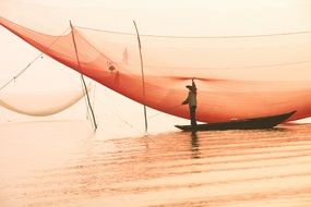 fisherman in boat sea landscape