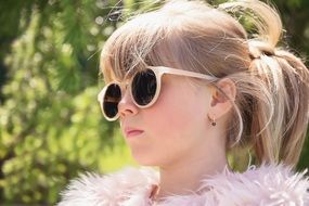 Blonde hair girl in fashion sunglasses