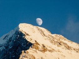 moon on the background of the mountain peak