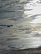 sunset over the ice of a frozen lake