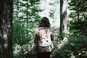 hiker with backpack in a forest