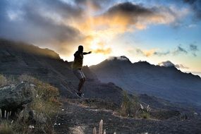 Jumping on the sunset in the mountains