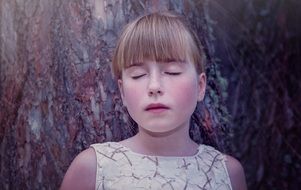 face of a girl with closed eyes