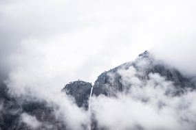 mountain waterfall in clouds Fog