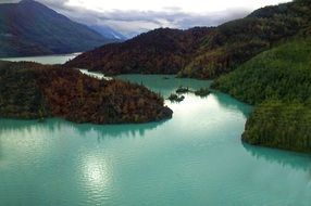 Beautiful, green river and mountains with plants, aerial landscape