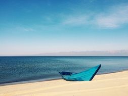 Empty boat on the empty beach