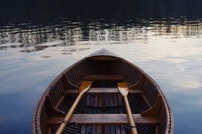 boat with oars on a calm lake