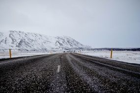 long road made of asphalt in winter