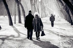 black and white photo of people in the park