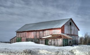 wooden barn in winter