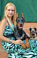 doberman pinscher yorkshire terrier and woman