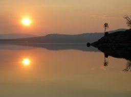 sunset sun over yellowstone lake