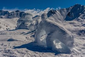 landscape of snowy statues on mountain at winter