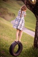 girl on the tire swing