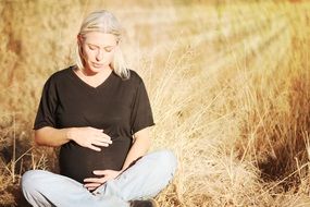 pregnant woman on a field