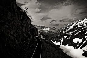 railway tracks in snow mountains