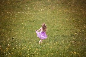 girl is running on the field