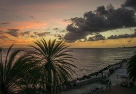 sunset in the clouds over the caribbean coast