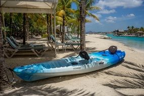 resort blue kayak on sand beach