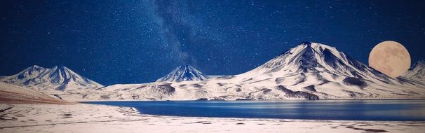 Mountains in the snow in the full moon