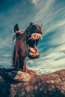 portrait of horse with opened mouth big teeth