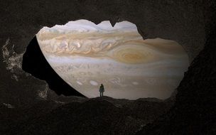 silhouette of a man at the entrance to the cave on the background of Jupiter