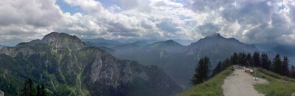 panorama in the alpine mountains with a trail