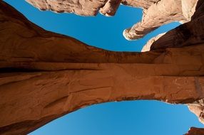 View from below on a stone arch in the national park, america